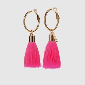 Gold hooped earrings with hot pink tassel